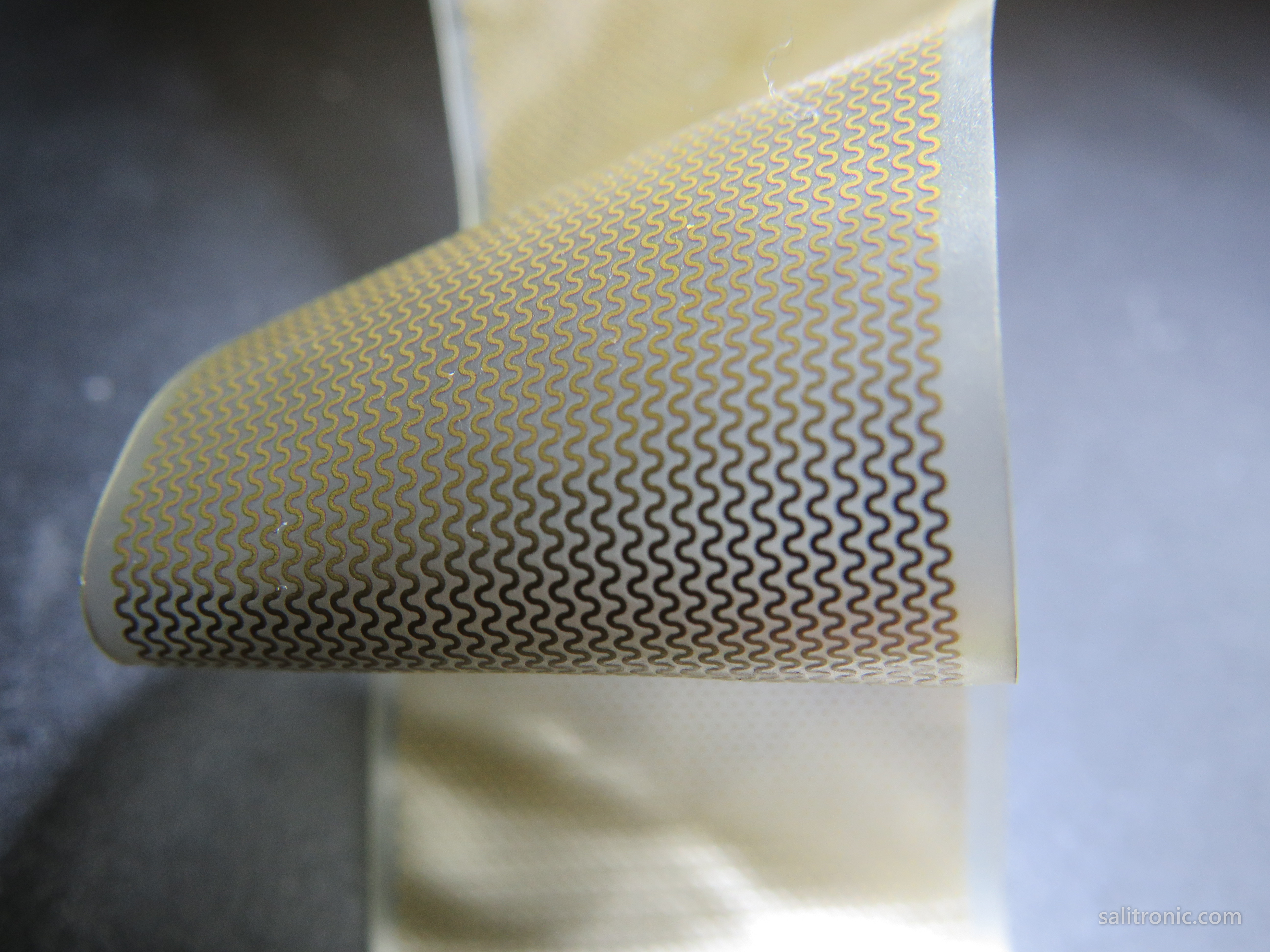 Stretchable PCB prototype with serpentine copper traces on flexible polyimide substrate